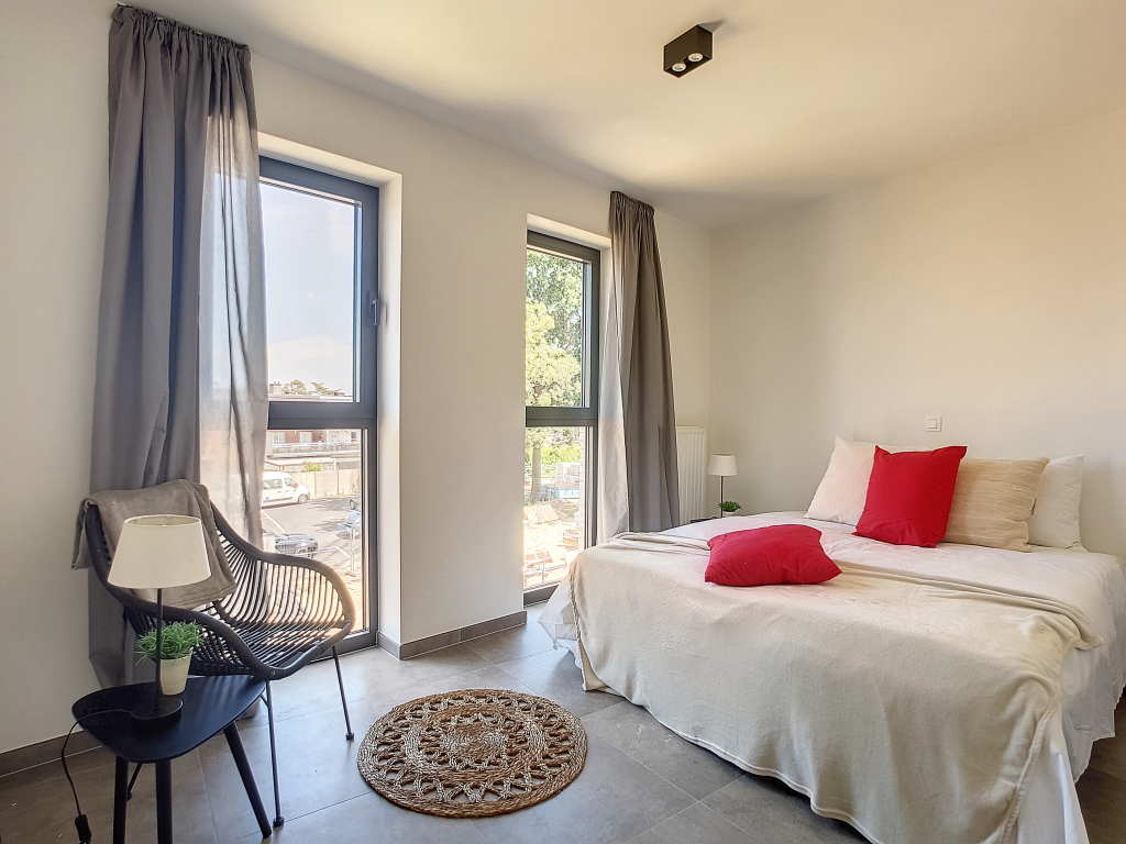 Slaapkamer kijkappartement in Arcelar te Aartselaar